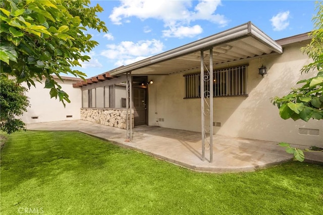 12319 Aneta St, Culver City, CA 90230 - rear view of property with stucco siding, a patio area, and a yard
