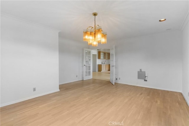 12319 Aneta St, Culver City, CA 90230 - spare room featuring a chandelier, ornamental molding, light wood finished floors, and french doors
