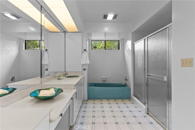 12319 Aneta St, Culver City, CA 90230 - bathroom with healthy amount of natural light, vanity, a shower with shower door, and tile patterned floors
