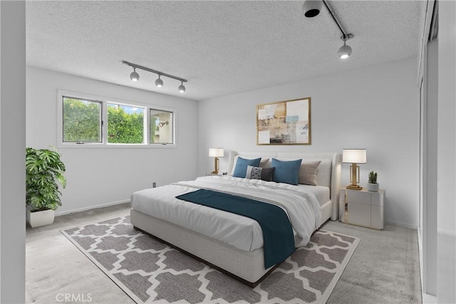 12319 Aneta St, Culver City, CA 90230 - bedroom with track lighting, light colored carpet, and a textured ceiling