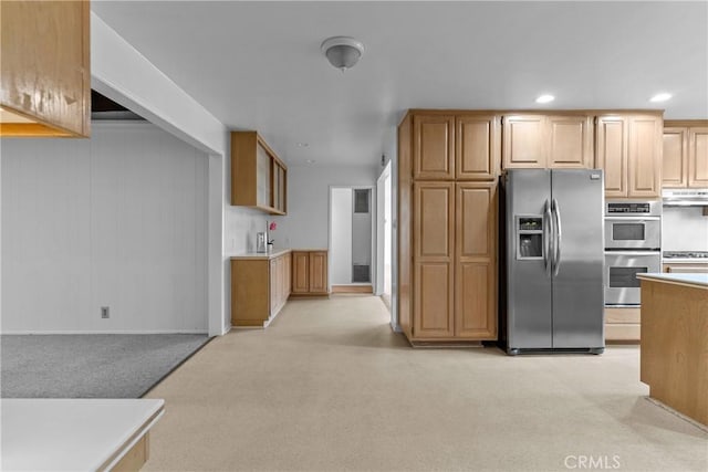 12319 Aneta St, Culver City, CA 90230 - kitchen with stainless steel appliances, light carpet, under cabinet range hood, recessed lighting, and light countertops
