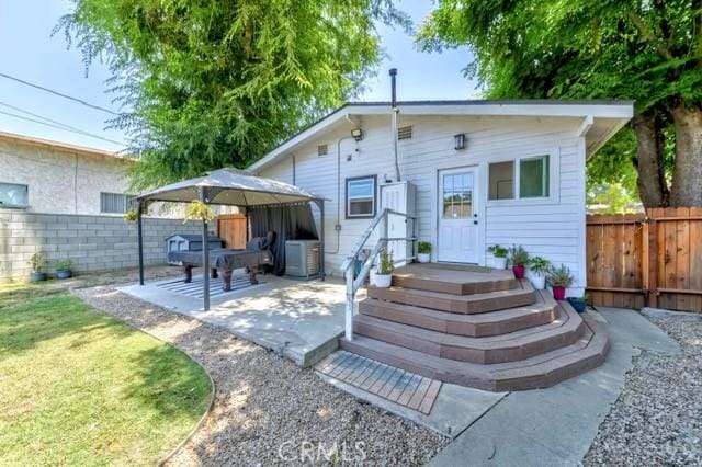 7933 Washington Ave, Whittier, CA 90602 - rear view of house featuring a fenced backyard and a patio area