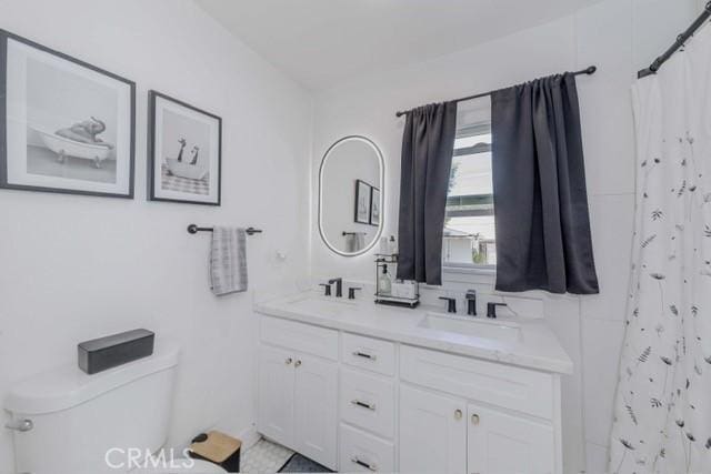 7933 Washington Ave, Whittier, CA 90602 - full bathroom with double vanity and a shower with shower curtain