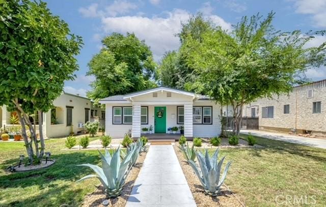 7933 Washington Ave, Whittier, CA 90602 - bungalow-style home with a front yard and covered porch