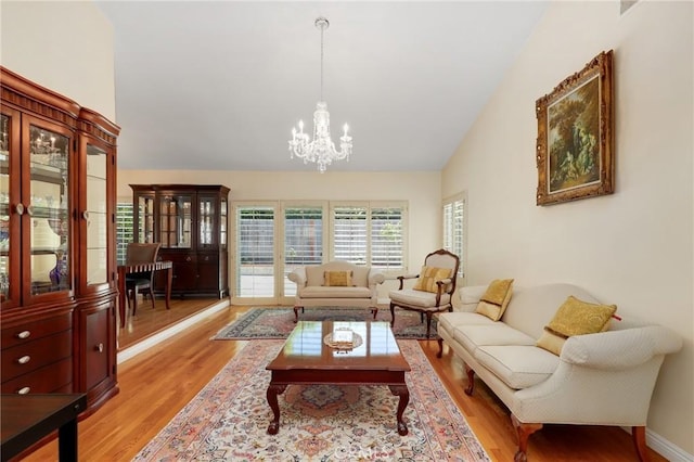 39 Foxhill, Irvine, CA 92604 - living area with a chandelier, light wood-type flooring, and high vaulted ceiling
