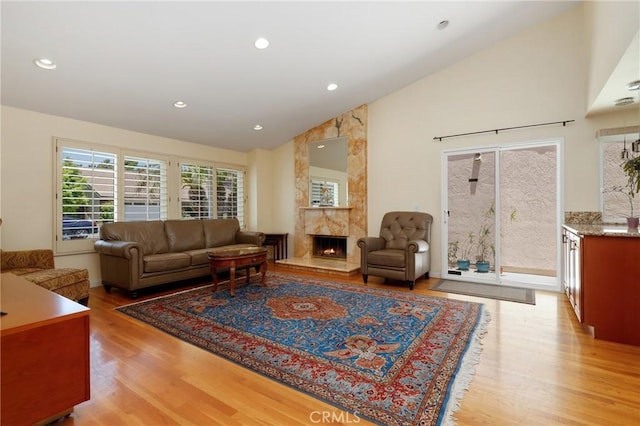 39 Foxhill, Irvine, CA 92604 - living area with light wood-type flooring, a fireplace, recessed lighting, and high vaulted ceiling