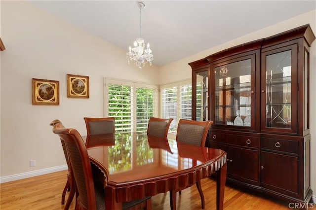 39 Foxhill, Irvine, CA 92604 - dining room featuring a chandelier, vaulted ceiling, and light wood-style flooring