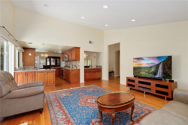39 Foxhill, Irvine, CA 92604 - living room featuring light wood-style flooring, high vaulted ceiling, and recessed lighting