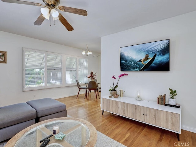 3042 E 3rd St Unit 5, Long Beach, CA 90814 - living room featuring light wood finished floors, a chandelier, and a ceiling fan