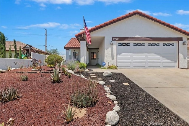 3920 Roxbury Dr, Hemet, CA 92545 - mediterranean / spanish-style home featuring stucco siding, a tile roof, concrete driveway, and a garage