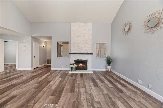 3920 Roxbury Dr, Hemet, CA 92545 - unfurnished living room featuring wood finished floors and a fireplace