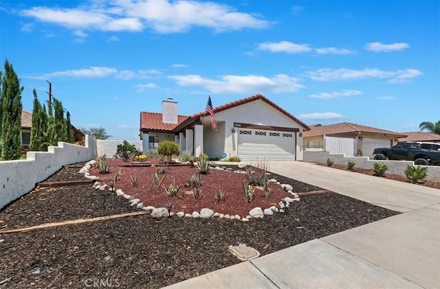 3920 Roxbury Dr, Hemet, CA 92545 - view of front of property with a garage, a chimney, concrete driveway, a tiled roof, and stucco siding