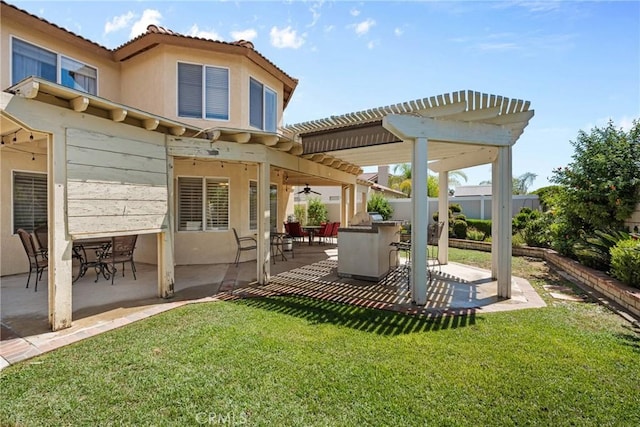 20241 Edmund Rd, Riverside, CA 92508 - back of house featuring a pergola, a patio area, ceiling fan, a tile roof, and stucco siding