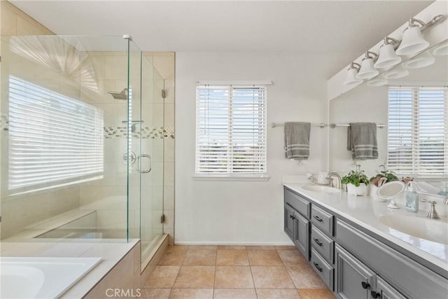 20241 Edmund Rd, Riverside, CA 92508 - bathroom with double vanity, a shower stall, a garden tub, and tile patterned flooring