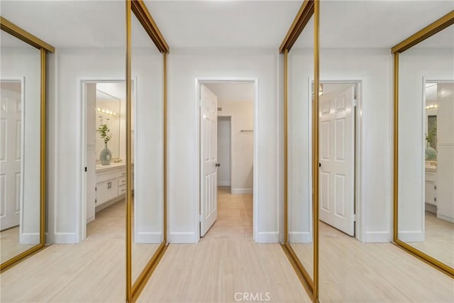 43791 Calle Las Brisas W, Palm Desert, CA 92211 - hall with light wood-style flooring and baseboards