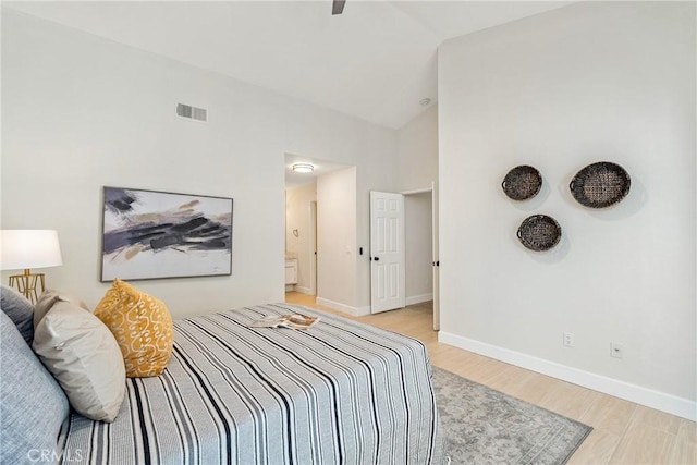 43791 Calle Las Brisas W, Palm Desert, CA 92211 - bedroom with light wood-type flooring and high vaulted ceiling