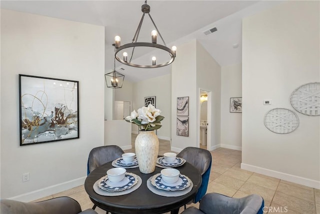 43791 Calle Las Brisas W, Palm Desert, CA 92211 - dining space with a chandelier, light tile patterned flooring, and high vaulted ceiling