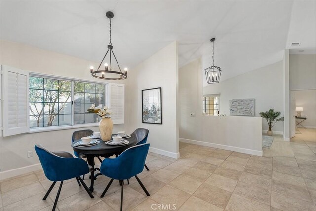 43791 Calle Las Brisas W, Palm Desert, CA 92211 - dining area featuring a chandelier and high vaulted ceiling
