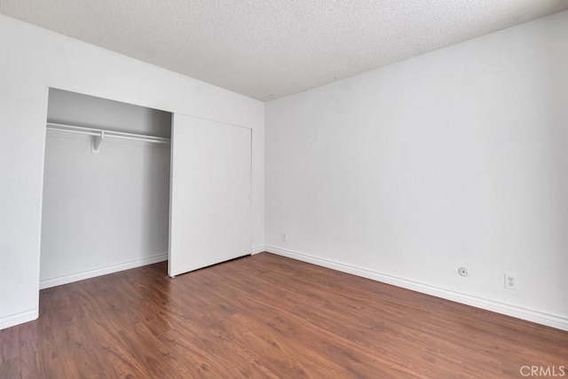20155 Keswick St Unit 211, Winnetka, CA 91306 - unfurnished bedroom featuring wood finished floors, a closet, and a textured ceiling