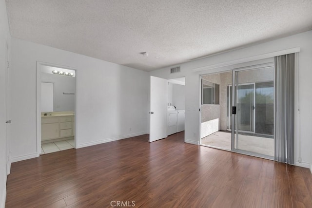 20155 Keswick St Unit 211, Winnetka, CA 91306 - unfurnished room with separate washer and dryer, wood finished floors, and a textured ceiling