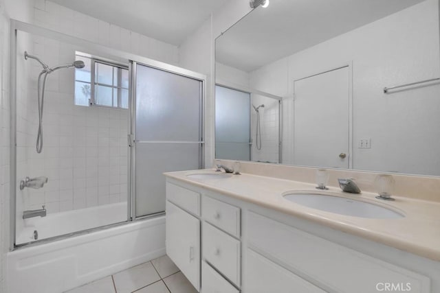 20155 Keswick St Unit 211, Winnetka, CA 91306 - bathroom featuring tile patterned flooring, double vanity, and bath / shower combo with glass door