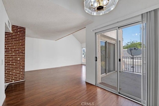 20155 Keswick St Unit 211, Winnetka, CA 91306 - interior space featuring wood finished floors, a chandelier, and a textured ceiling