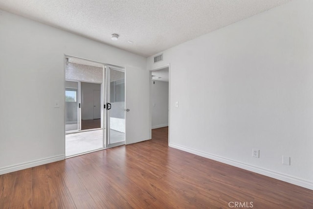 20155 Keswick St Unit 211, Winnetka, CA 91306 - unfurnished room with a textured ceiling and wood finished floors