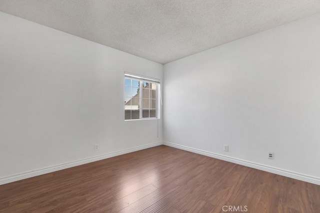 20155 Keswick St Unit 211, Winnetka, CA 91306 - empty room with wood finished floors and a textured ceiling