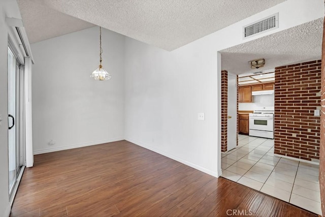 20155 Keswick St Unit 211, Winnetka, CA 91306 - empty room with a textured ceiling and light wood-type flooring