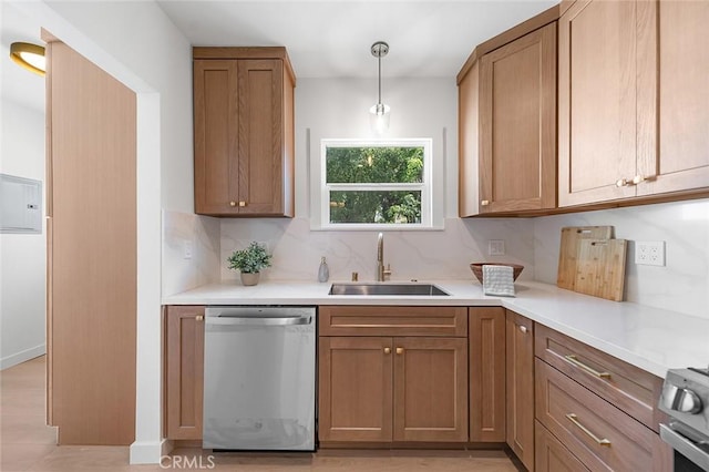 1951 Wagner St, Pasadena, CA 91107 - kitchen featuring dishwasher, backsplash, electric panel, light countertops, and brown cabinetry