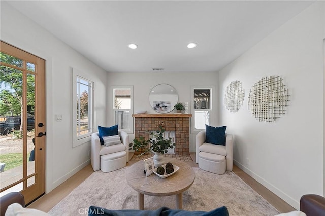 1951 Wagner St, Pasadena, CA 91107 - living area featuring healthy amount of natural light, light wood finished floors, recessed lighting, and a fireplace