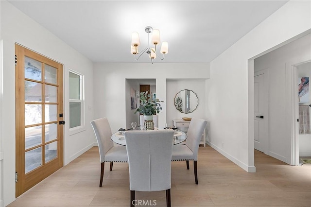 1951 Wagner St, Pasadena, CA 91107 - dining room with a chandelier and light wood-style flooring