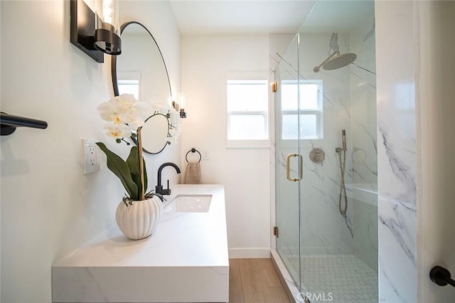 1951 Wagner St, Pasadena, CA 91107 - bathroom featuring a marble finish shower, double vanity, and wood finished floors