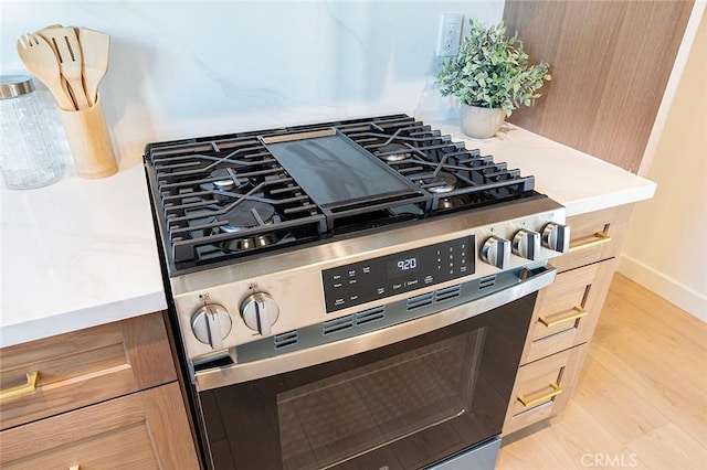 1951 Wagner St, Pasadena, CA 91107 - kitchen view of stainless steel gas range, light wood finished floors, and light countertops