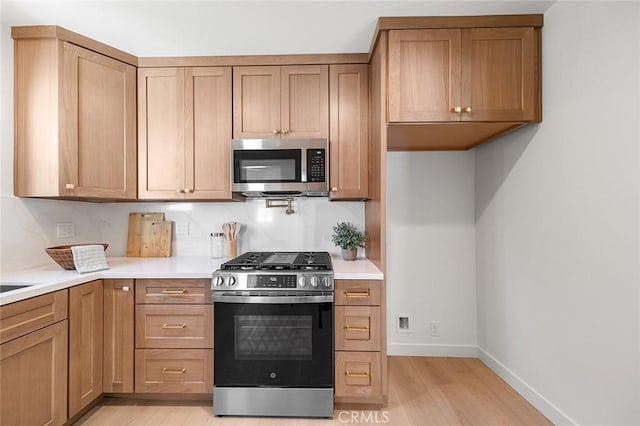 1951 Wagner St, Pasadena, CA 91107 - kitchen with stainless steel appliances, light wood finished floors, and light countertops
