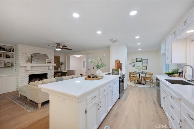 6330 N Wilson Ave, Fresno, CA 93704 - kitchen featuring stainless steel appliances, a ceiling fan, white cabinetry, light countertops, and recessed lighting