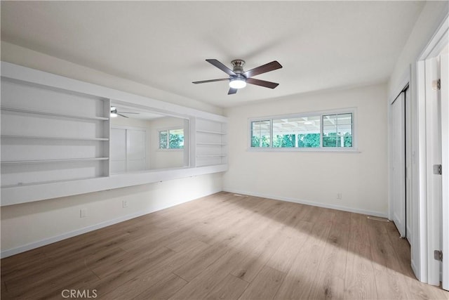 6330 N Wilson Ave, Fresno, CA 93704 - unfurnished bedroom with wood finished floors and a ceiling fan