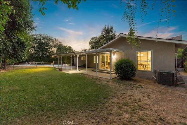 6330 N Wilson Ave, Fresno, CA 93704 - rear view of property with a fenced backyard, a patio, and stucco siding