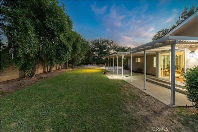 6330 N Wilson Ave, Fresno, CA 93704 - fenced backyard with a patio