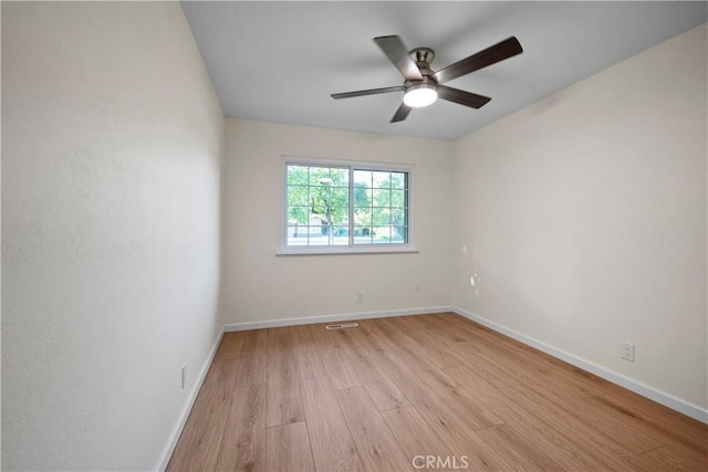 6330 N Wilson Ave, Fresno, CA 93704 - empty room with light wood-style flooring and a ceiling fan