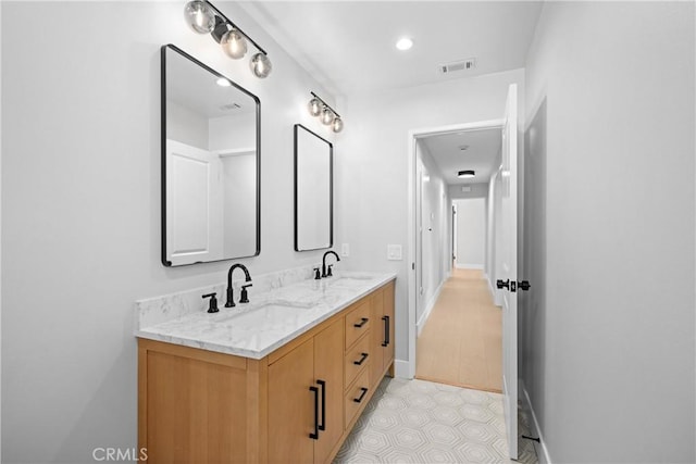 9211 Regency Way, Rancho Cucamonga, CA 91701 - bathroom with double vanity and baseboards