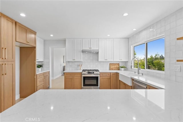 9211 Regency Way, Rancho Cucamonga, CA 91701 - kitchen with stainless steel appliances, light stone countertops, tasteful backsplash, under cabinet range hood, and recessed lighting