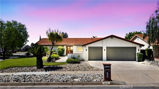 9211 Regency Way, Rancho Cucamonga, CA 91701 - ranch-style house featuring a tile roof, a garage, driveway, a front lawn, and stucco siding