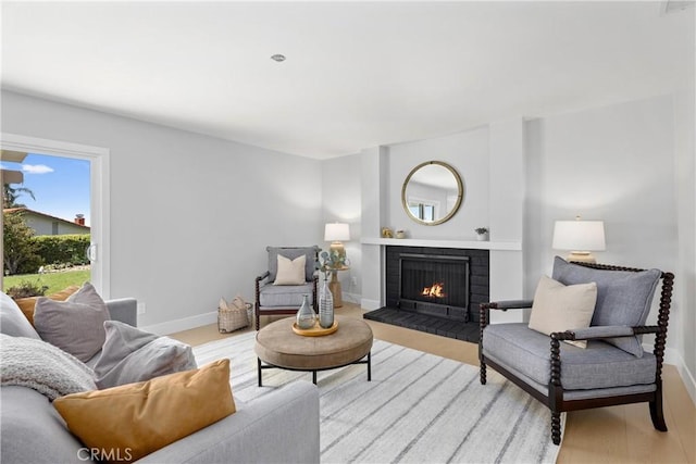 9211 Regency Way, Rancho Cucamonga, CA 91701 - living area featuring a fireplace and light wood finished floors