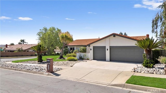 9211 Regency Way, Rancho Cucamonga, CA 91701 - ranch-style house with a tile roof, a garage, driveway, and stucco siding