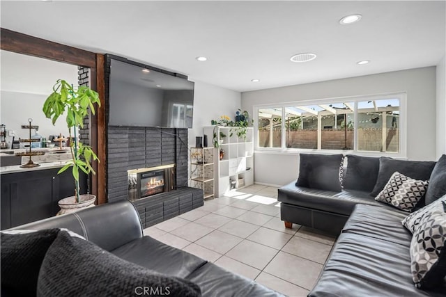43657 21st St W, Lancaster, CA 93536 - living area with light tile patterned floors, a fireplace, and recessed lighting