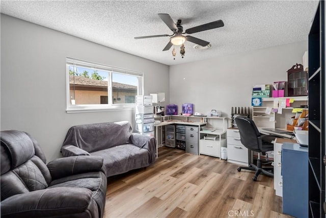 43657 21st St W, Lancaster, CA 93536 - home office with ceiling fan, light wood-style flooring, and a textured ceiling