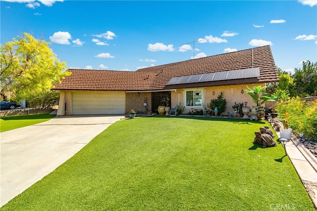 43657 21st St W, Lancaster, CA 93536 - view of front facade featuring a garage, a front lawn, and stucco siding