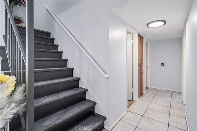 43657 21st St W, Lancaster, CA 93536 - stairway with baseboards and tile patterned flooring