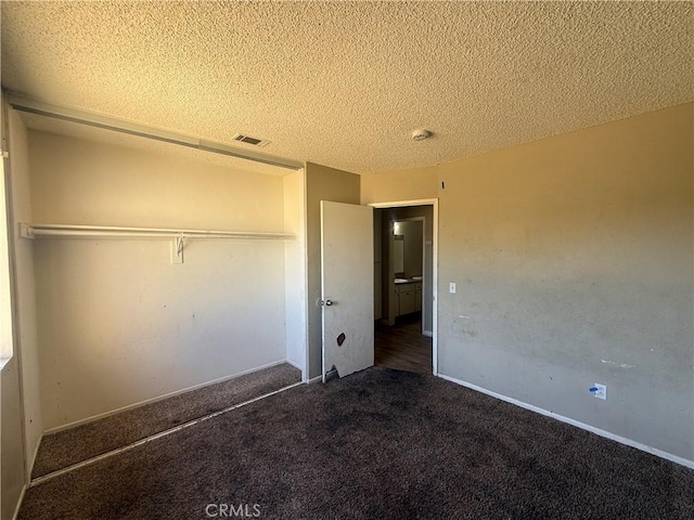 15569 Athol St, Fontana, CA 92335 - unfurnished bedroom featuring carpet floors, a textured ceiling, and a closet